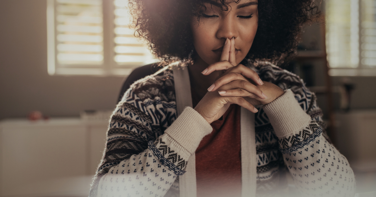 A woman who appears to be deep in thought or making a tough decision